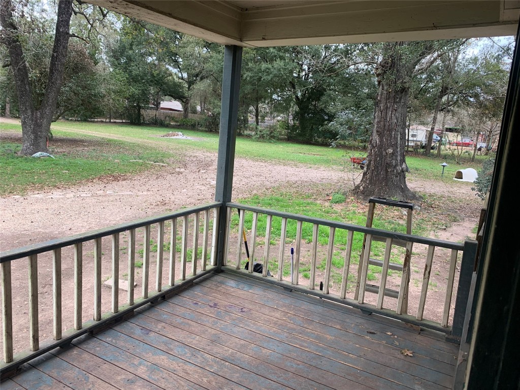 22720 Hudson Road New Caney, TX 77357 - Photo 37 of 40 a view of a porch with a yard
