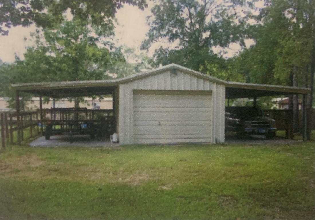 22720 Hudson Road New Caney, TX 77357 - Photo 6 of 40 a front view of a house with a garden