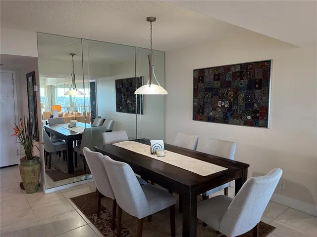 a view of walk in closet with clothes