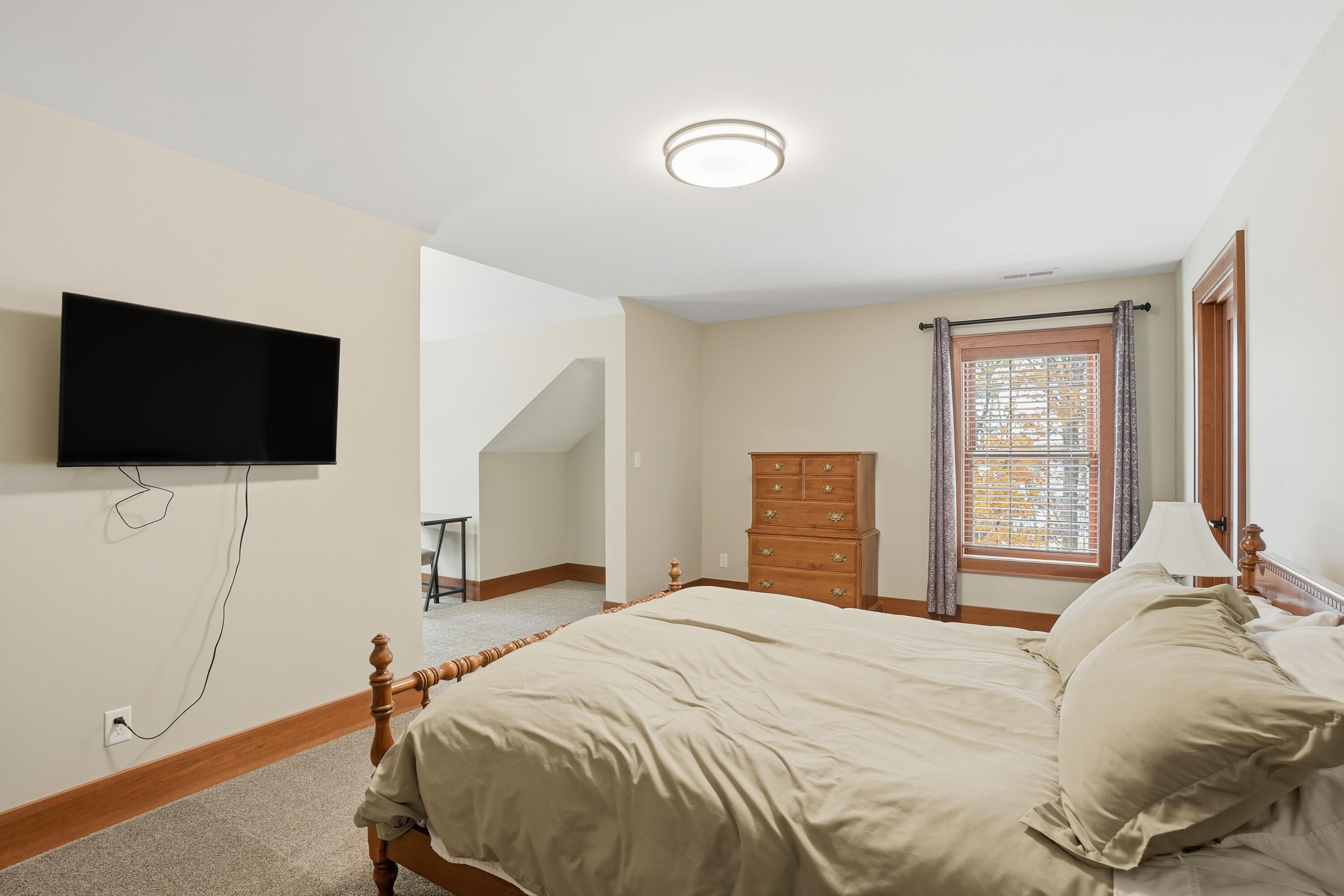 804 Shannon Drive Crown Point, IN 46307 - Photo 59 of 79 a bedroom with a bed and a flat screen tv