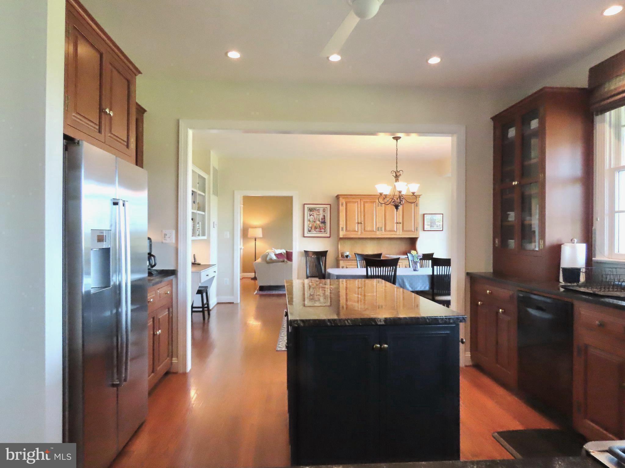 643 Richmond Road Amissville, VA 20106 - Photo 15 of 48 a kitchen with stainless steel appliances kitchen island granite countertop a refrigerator and a sink