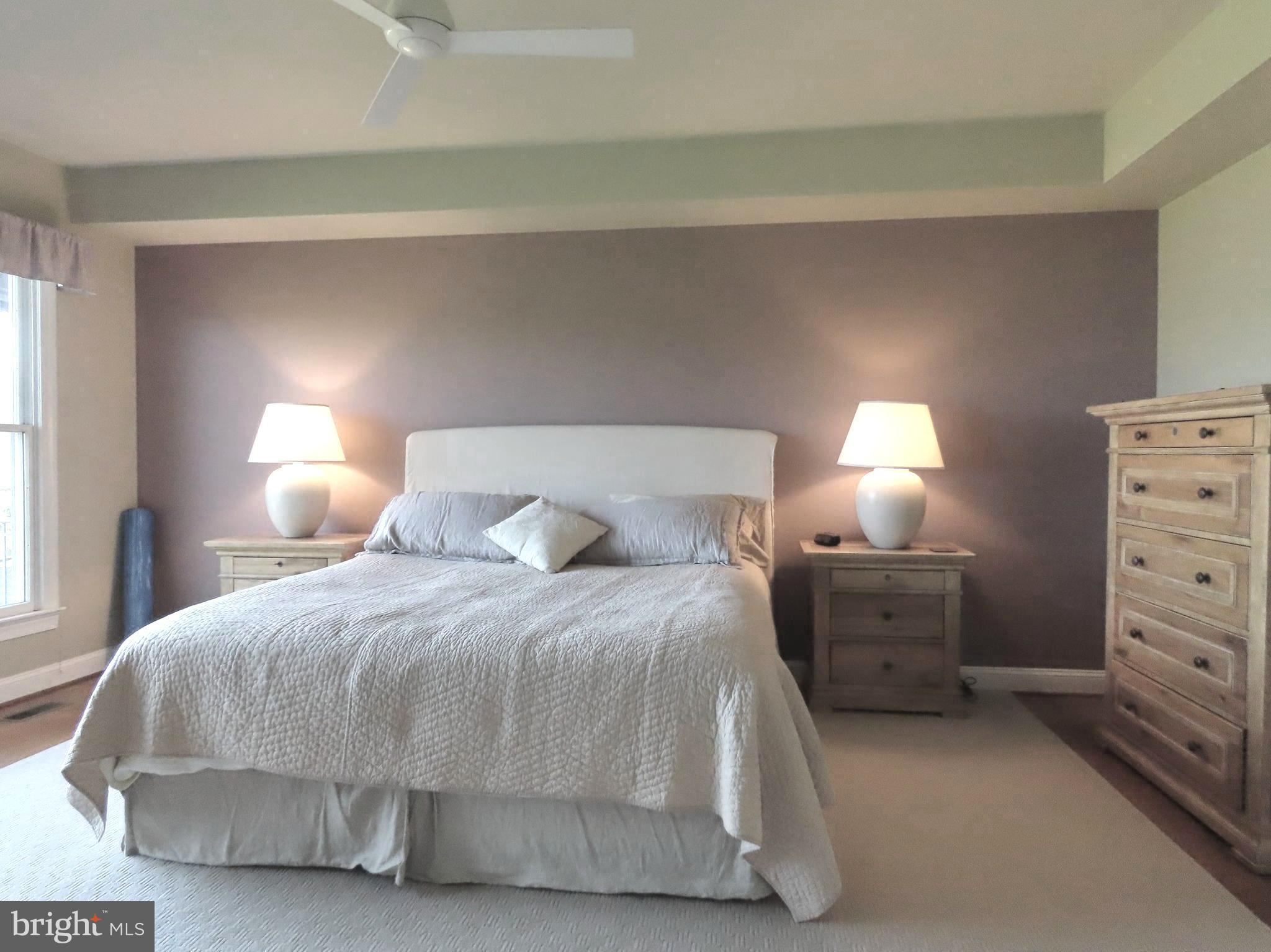 643 Richmond Road Amissville, VA 20106 - Photo 25 of 52 a bedroom with a bed and lamp