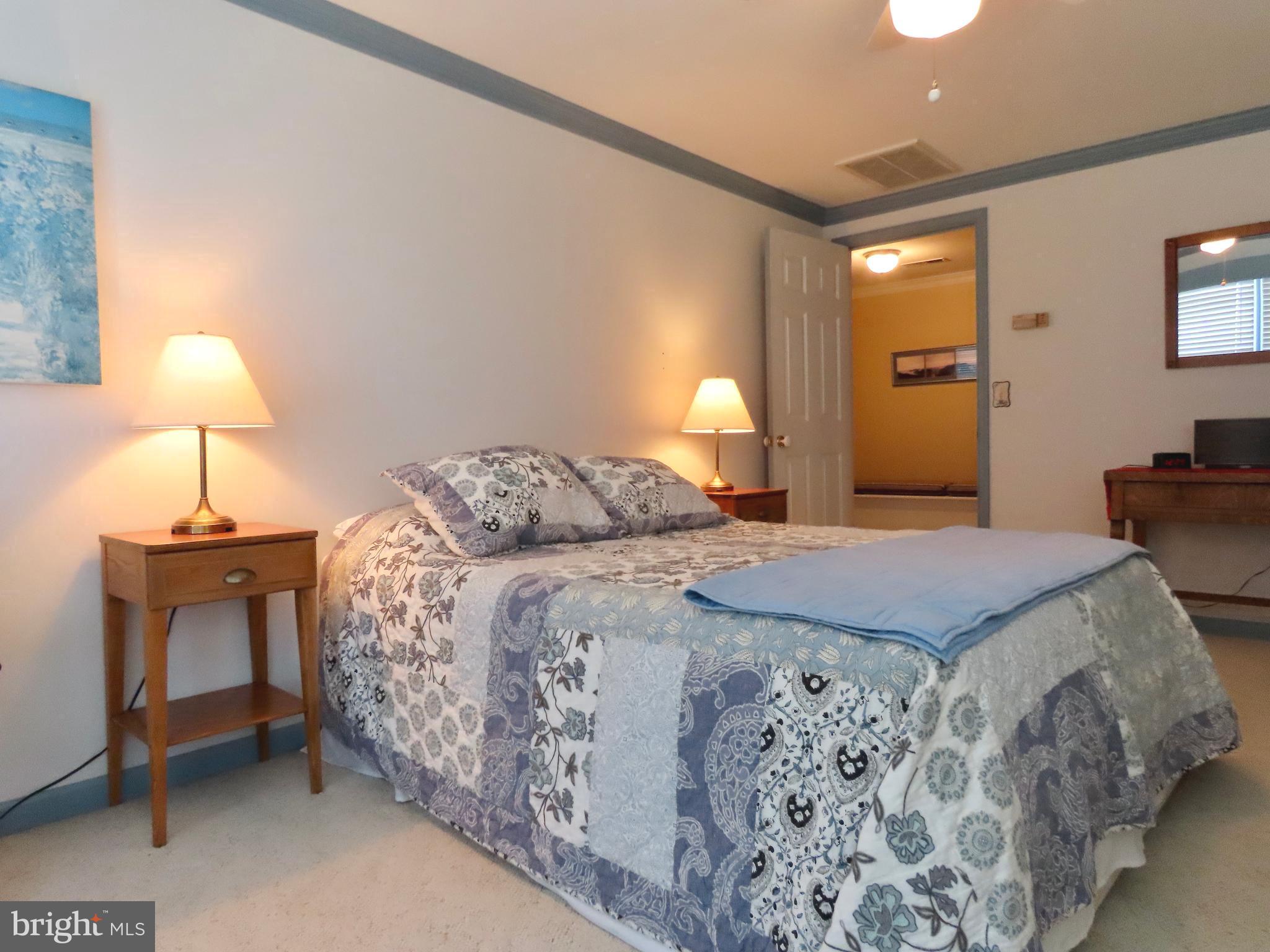 643 Richmond Road Amissville, VA 20106 - Photo 37 of 52 a bedroom with a bed and a lamp