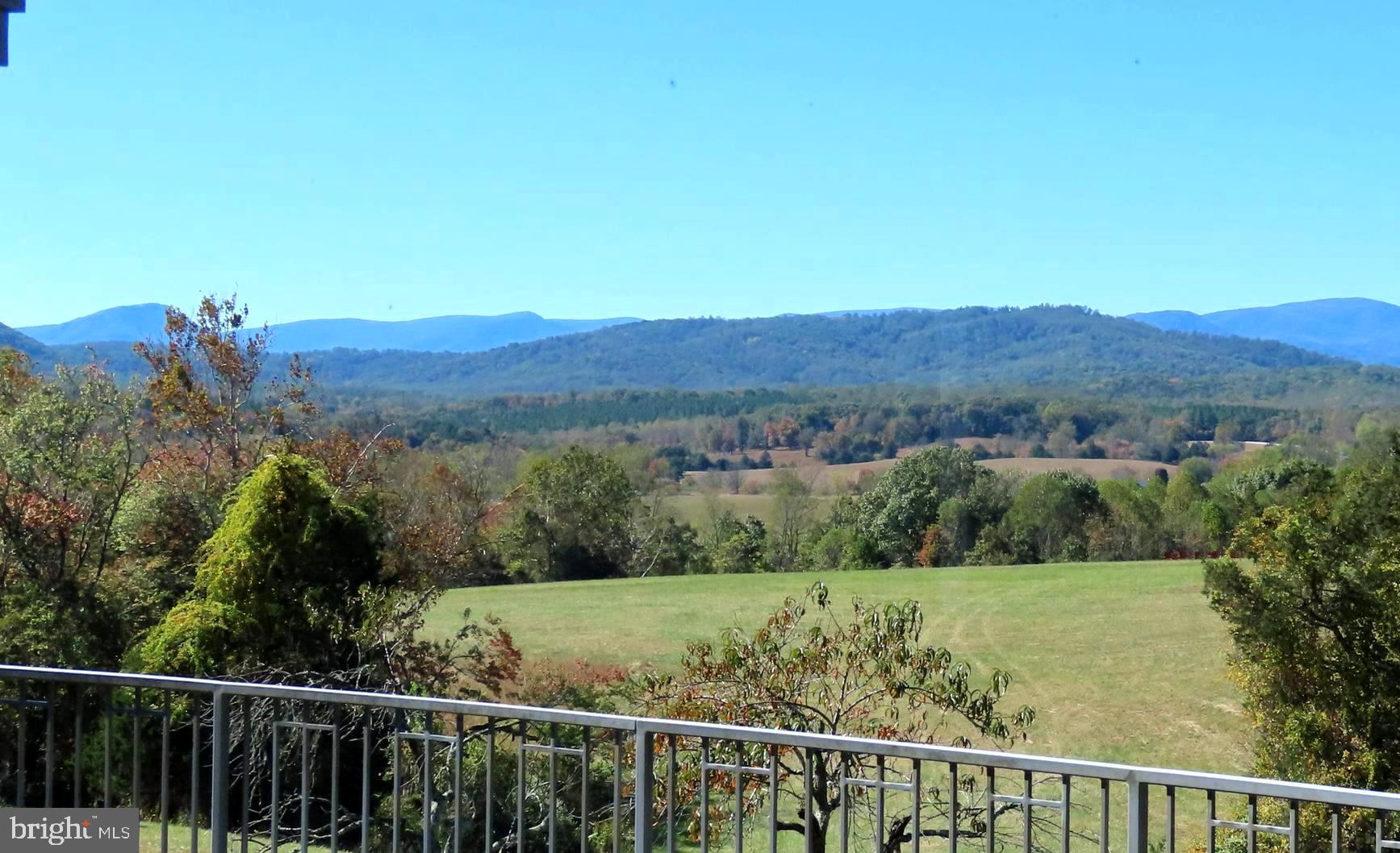 643 Richmond Road Amissville, VA 20106 - Photo 5 of 52 a view of a green field with mountains in the background