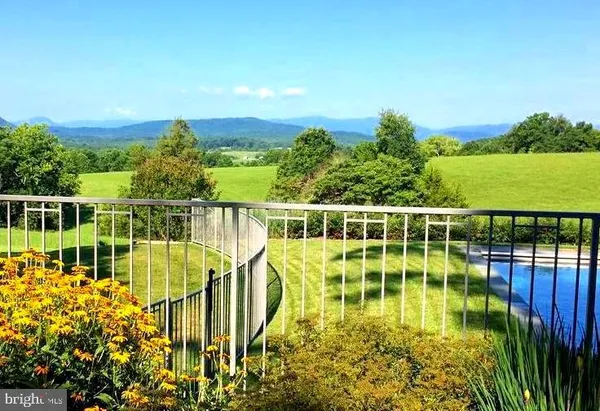 a view of a lake with a garden