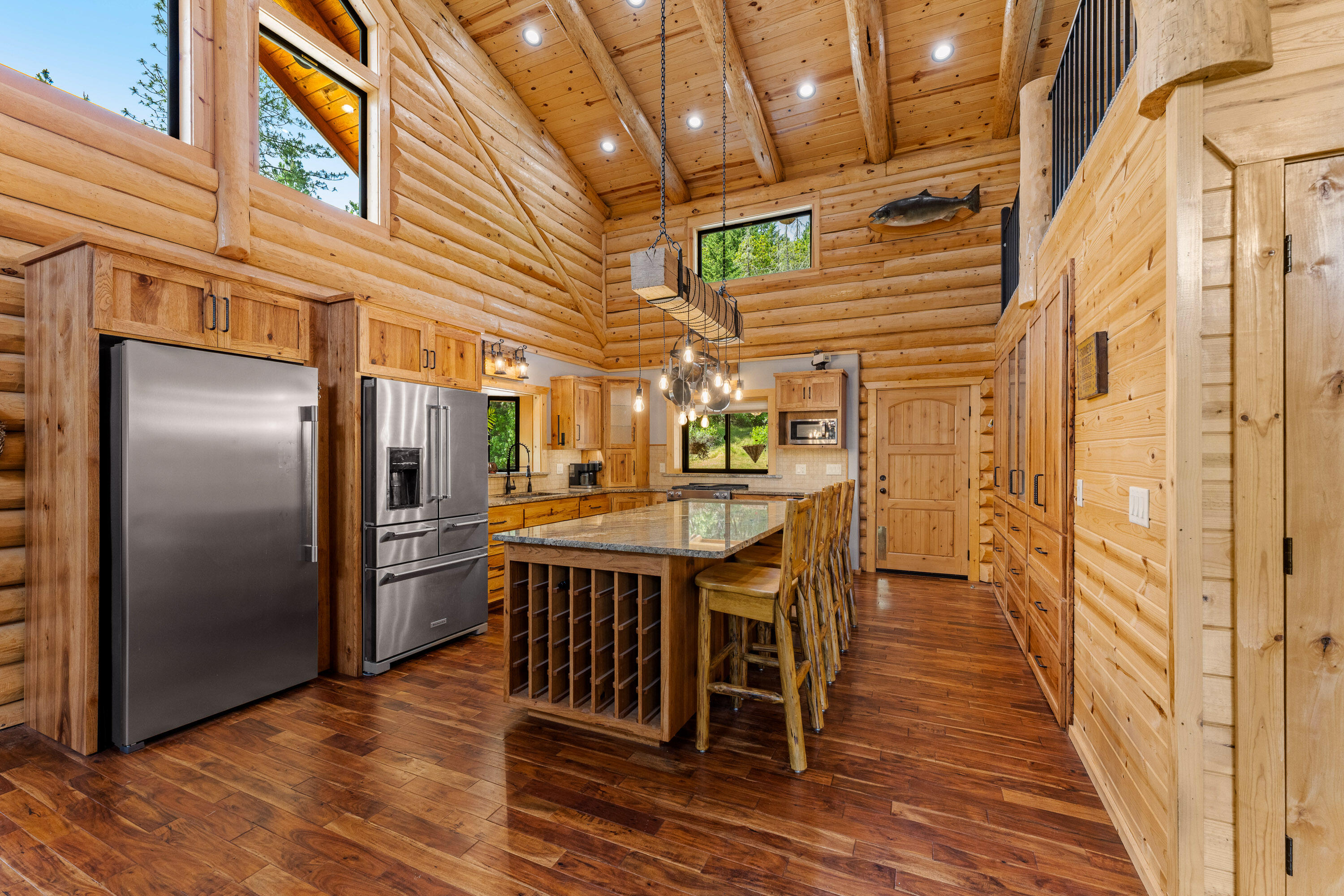 225 Eagle Ridge Road Canyonville, OR 97417 - Photo 27 of 52 a dining room with stainless steel appliances a table and chairs
