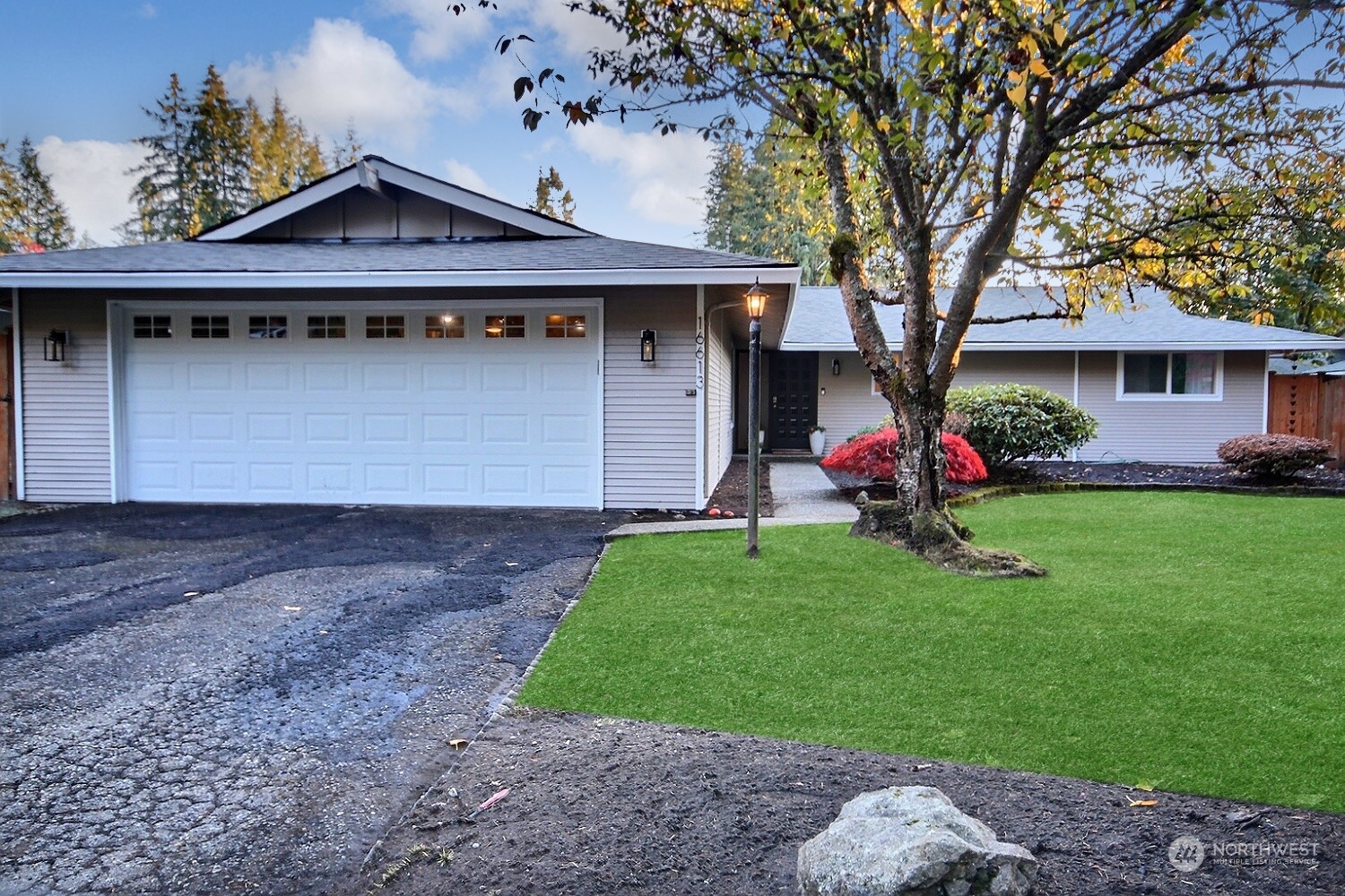 16613 Southeast 145th Street Renton, WA 98059 - Photo 1 of 40 a front view of a house with a yard and garage