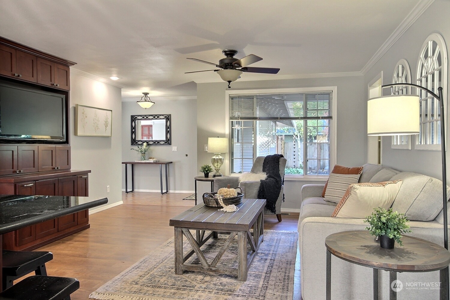 16613 Southeast 145th Street Renton, WA 98059 - Photo 12 of 40 a living room with furniture a flat screen tv and a large window