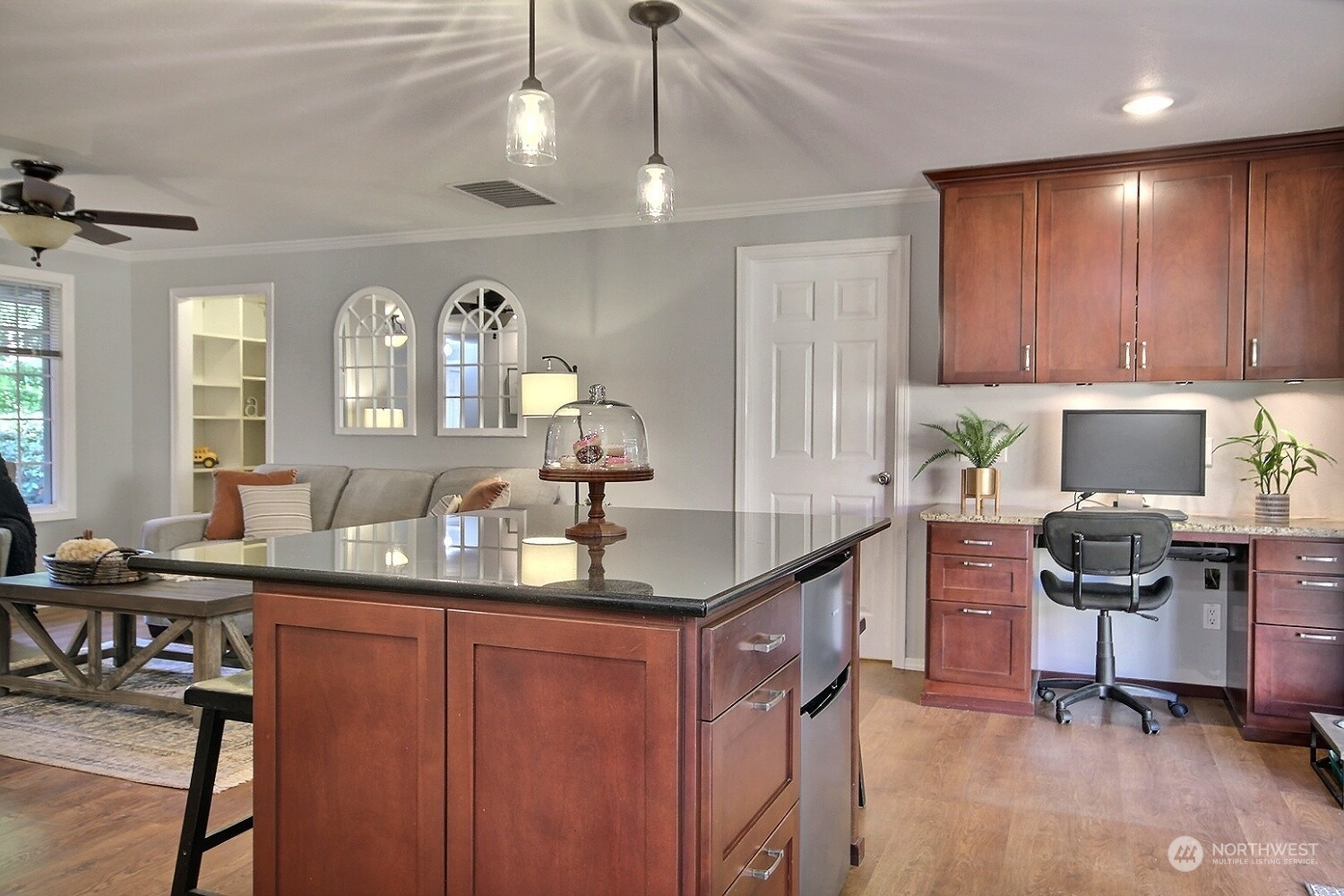 16613 Southeast 145th Street Renton, WA 98059 - Photo 14 of 40 a kitchen with granite countertop a sink stove and cabinets