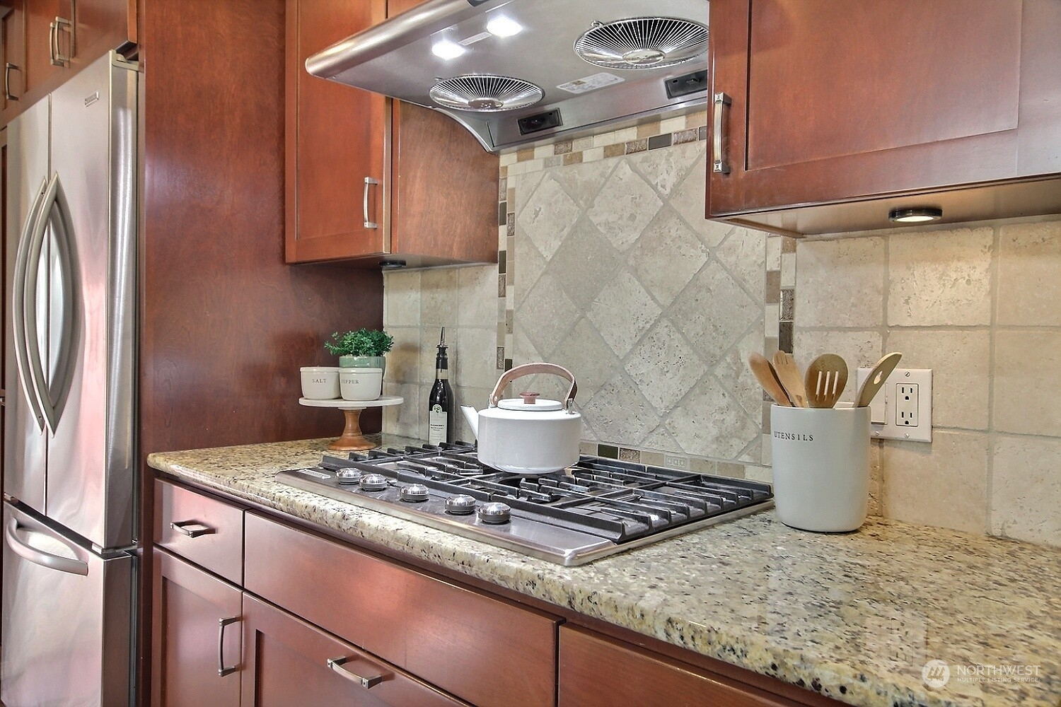 16613 Southeast 145th Street Renton, WA 98059 - Photo 16 of 40 a stove top oven sitting inside of a kitchen