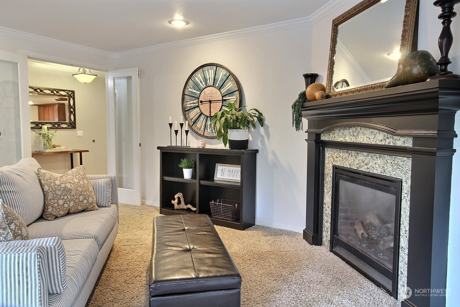 16613 Southeast 145th Street Renton, WA 98059 - Photo 25 of 40 a living room with furniture and a fireplace