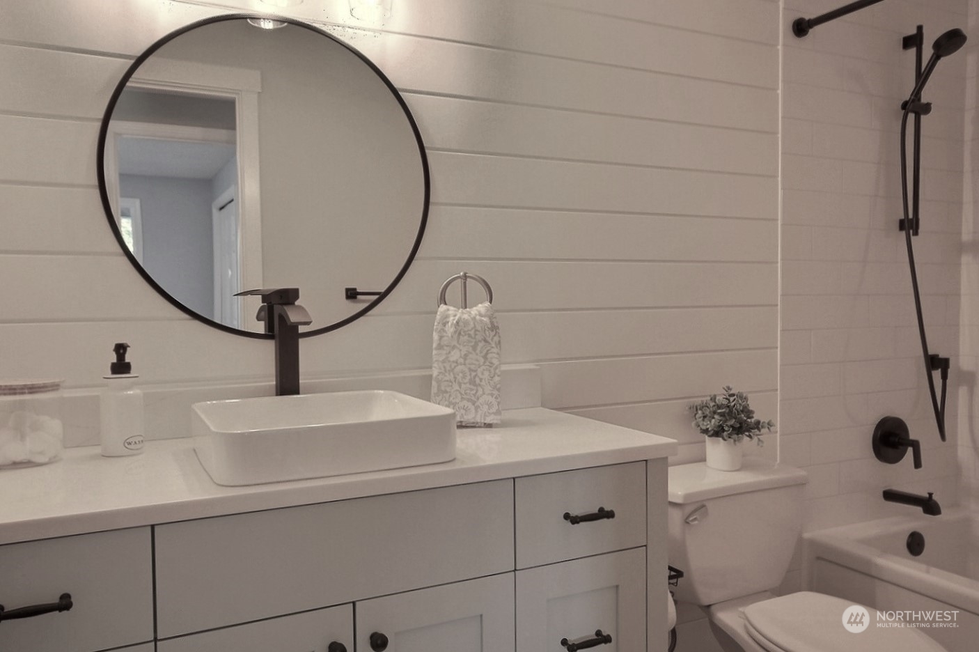 16613 Southeast 145th Street Renton, WA 98059 - Photo 28 of 40 a bathroom with a sink and a mirror