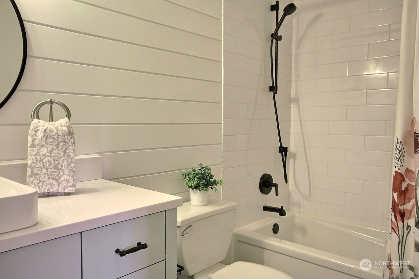 16613 Southeast 145th Street Renton, WA 98059 - Photo 29 of 40 a bathroom with a granite countertop sink a toilet and bathtub
