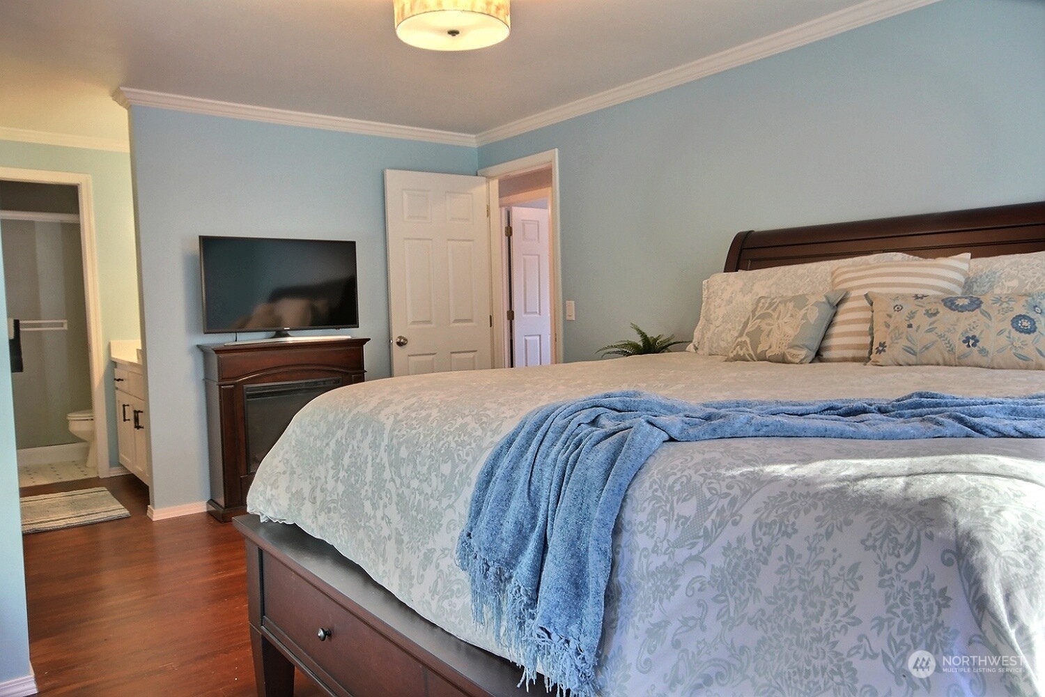 16613 Southeast 145th Street Renton, WA 98059 - Photo 30 of 40 a bedroom with a bed and a flat screen tv