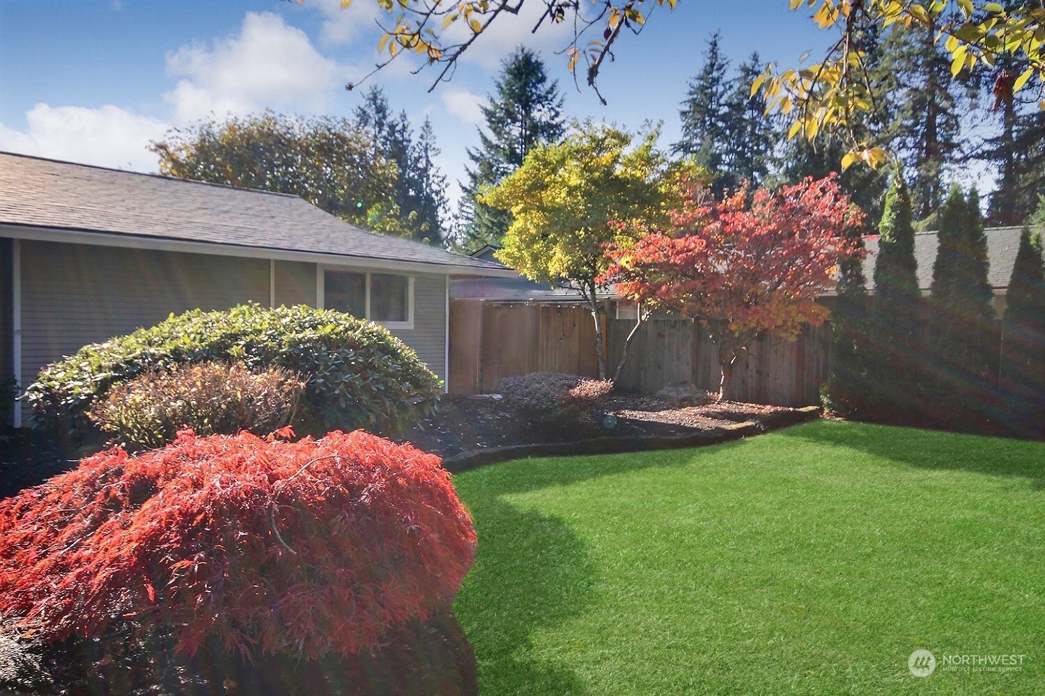 16613 Southeast 145th Street Renton, WA 98059 - Photo 3 of 40 a backyard of a house with table and chairs and potted plants