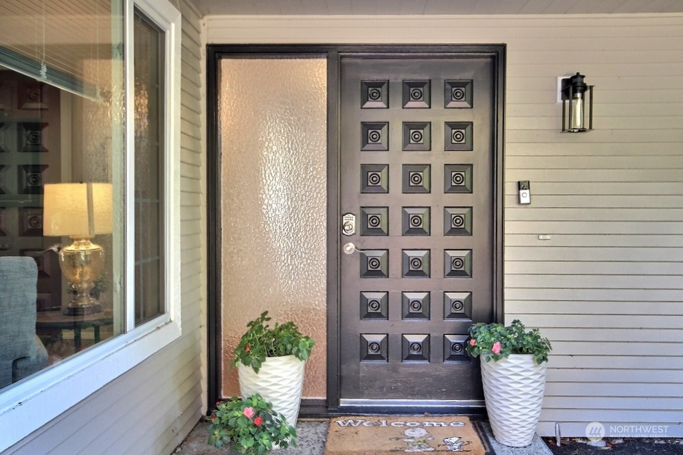 16613 Southeast 145th Street Renton, WA 98059 - Photo 4 of 40 a potted plant sitting in front of a glass door