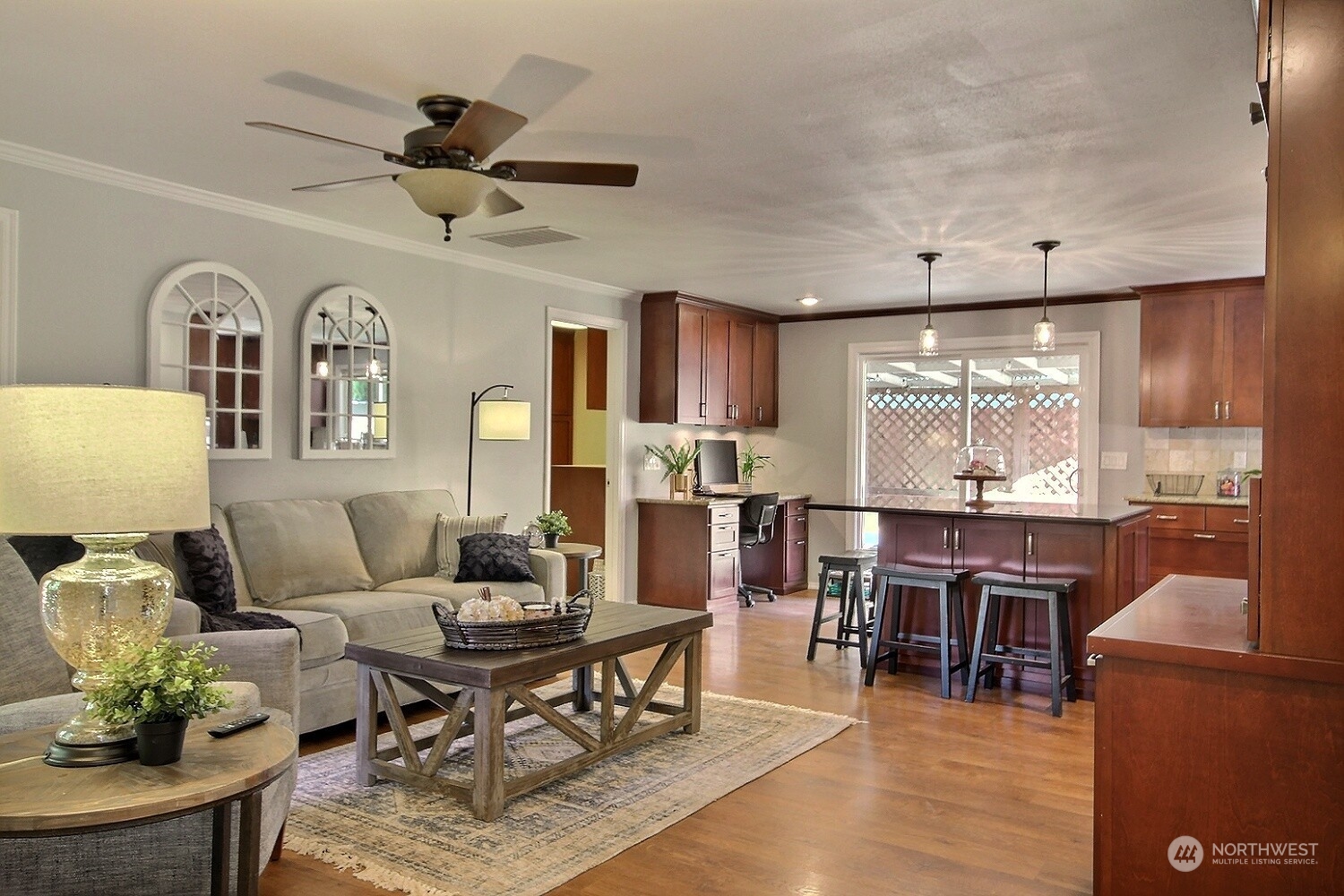 16613 Southeast 145th Street Renton, WA 98059 - Photo 6 of 40 a living room with furniture kitchen view and a wooden floor