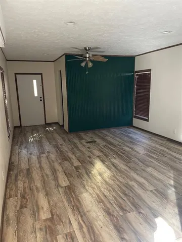 a view of kitchen with refrigerator stove microwave and cabinets