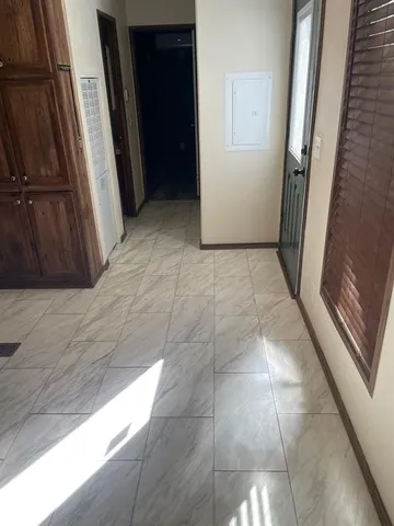 a bathroom with a granite countertop toilet and a bathtub
