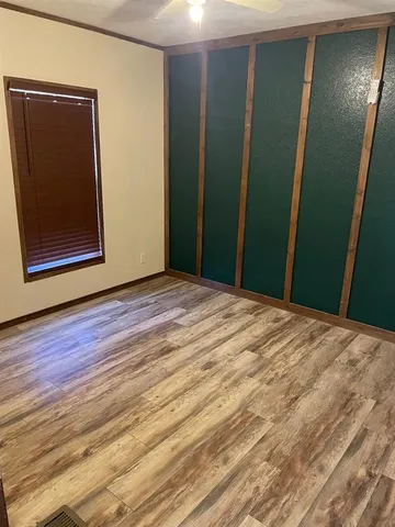 a kitchen with granite countertop a refrigerator stove and microwave