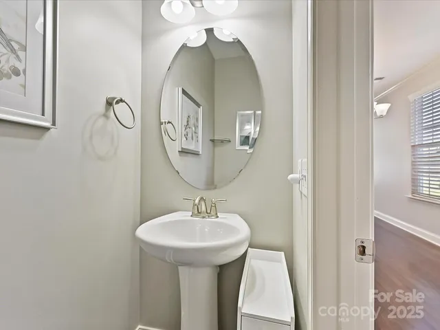 a bathroom with a sink and mirror