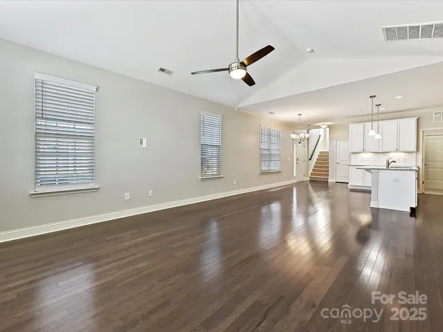 a view of a kitchen with a sink and a window