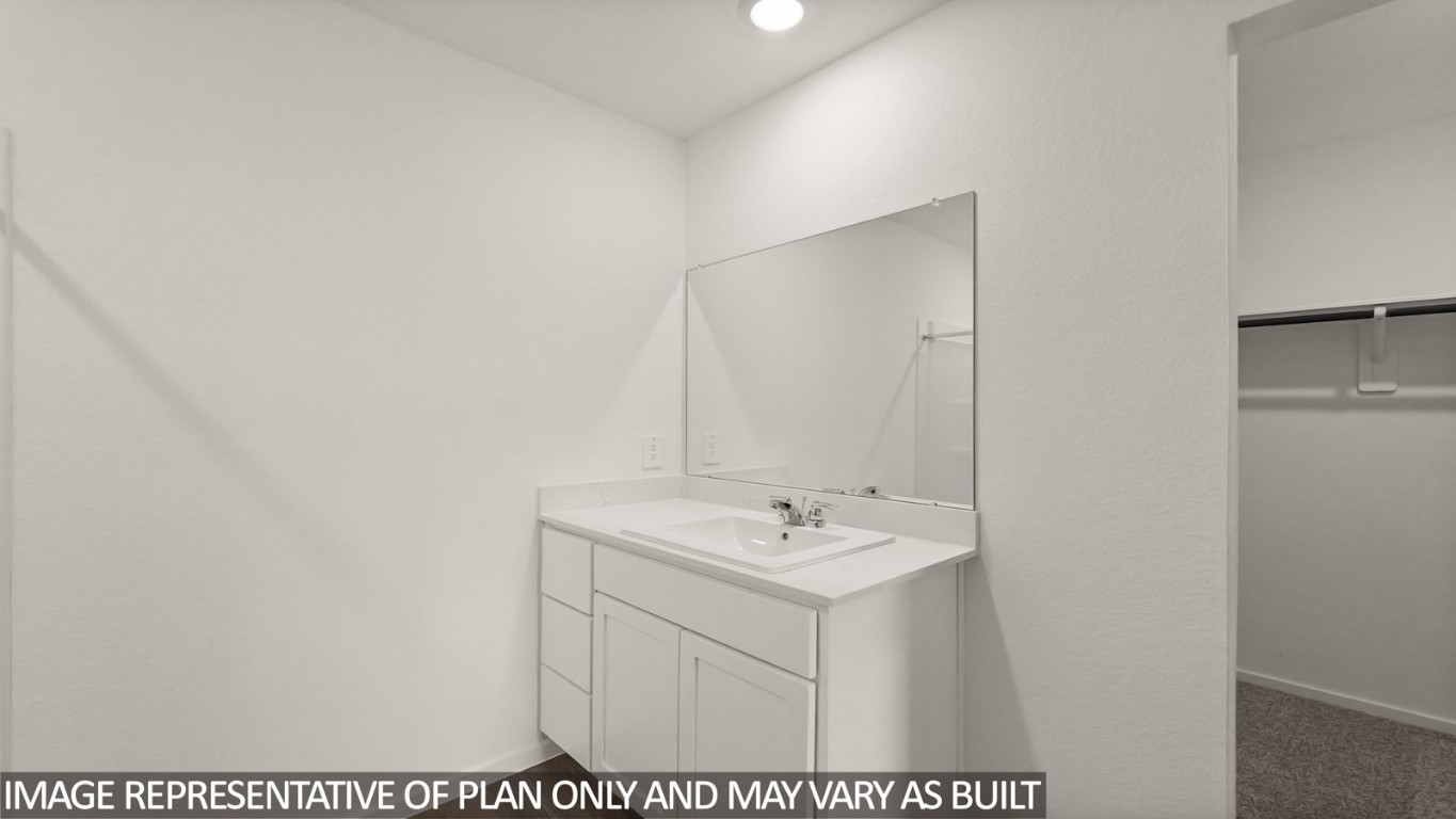 14609 Ivy Floral Way Splendora, TX 77372 - Photo 11 of 23 a bathroom with a sink and a mirror