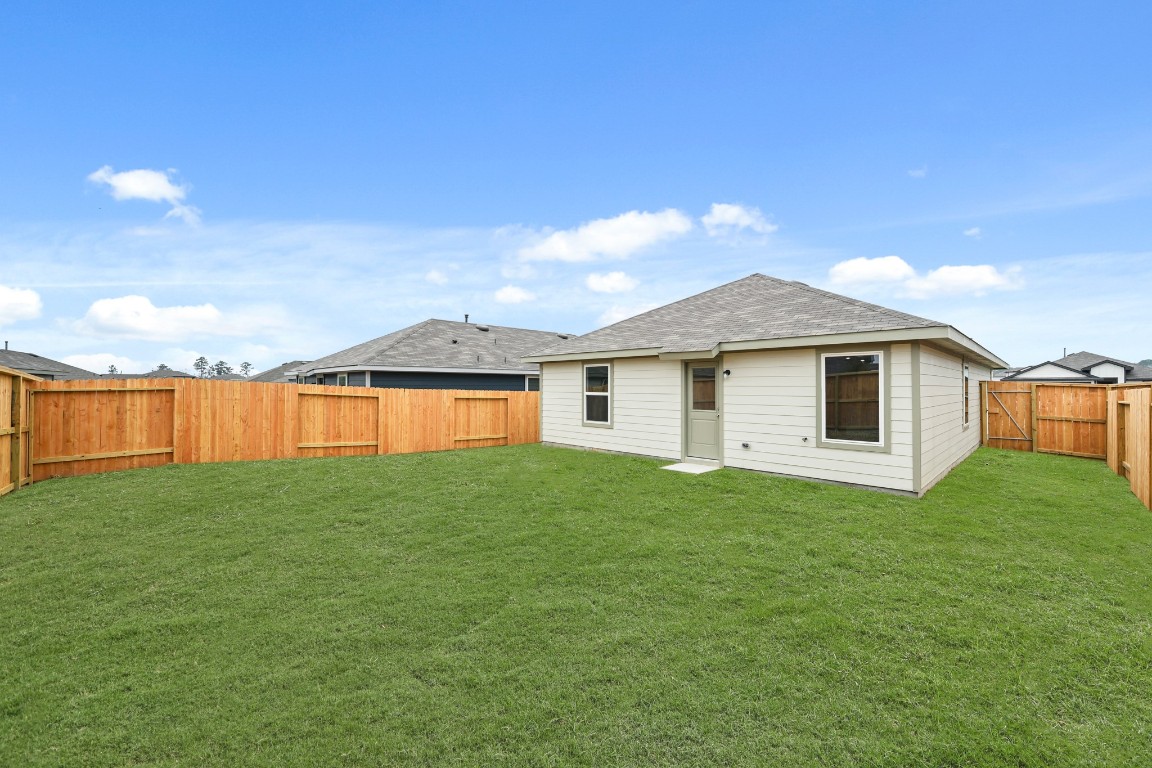 14609 Ivy Floral Way Splendora, TX 77372 - Photo 14 of 23 a house view with a garden space