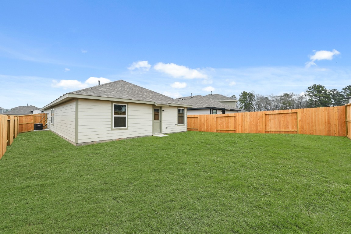 14609 Ivy Floral Way Splendora, TX 77372 - Photo 16 of 23 a view of a house with a backyard