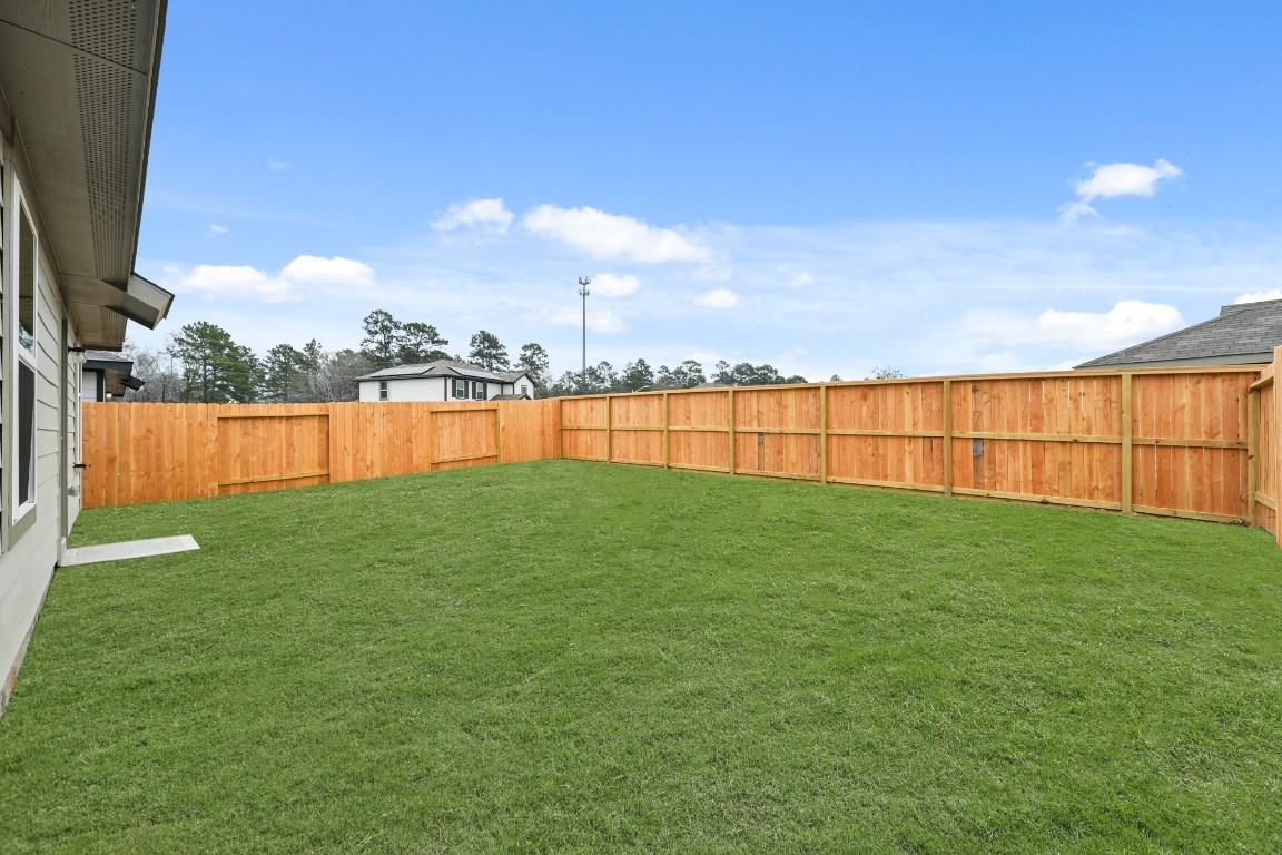 14609 Ivy Floral Way Splendora, TX 77372 - Photo 17 of 23 a view of outdoor space with swimming pool and valleys in the background