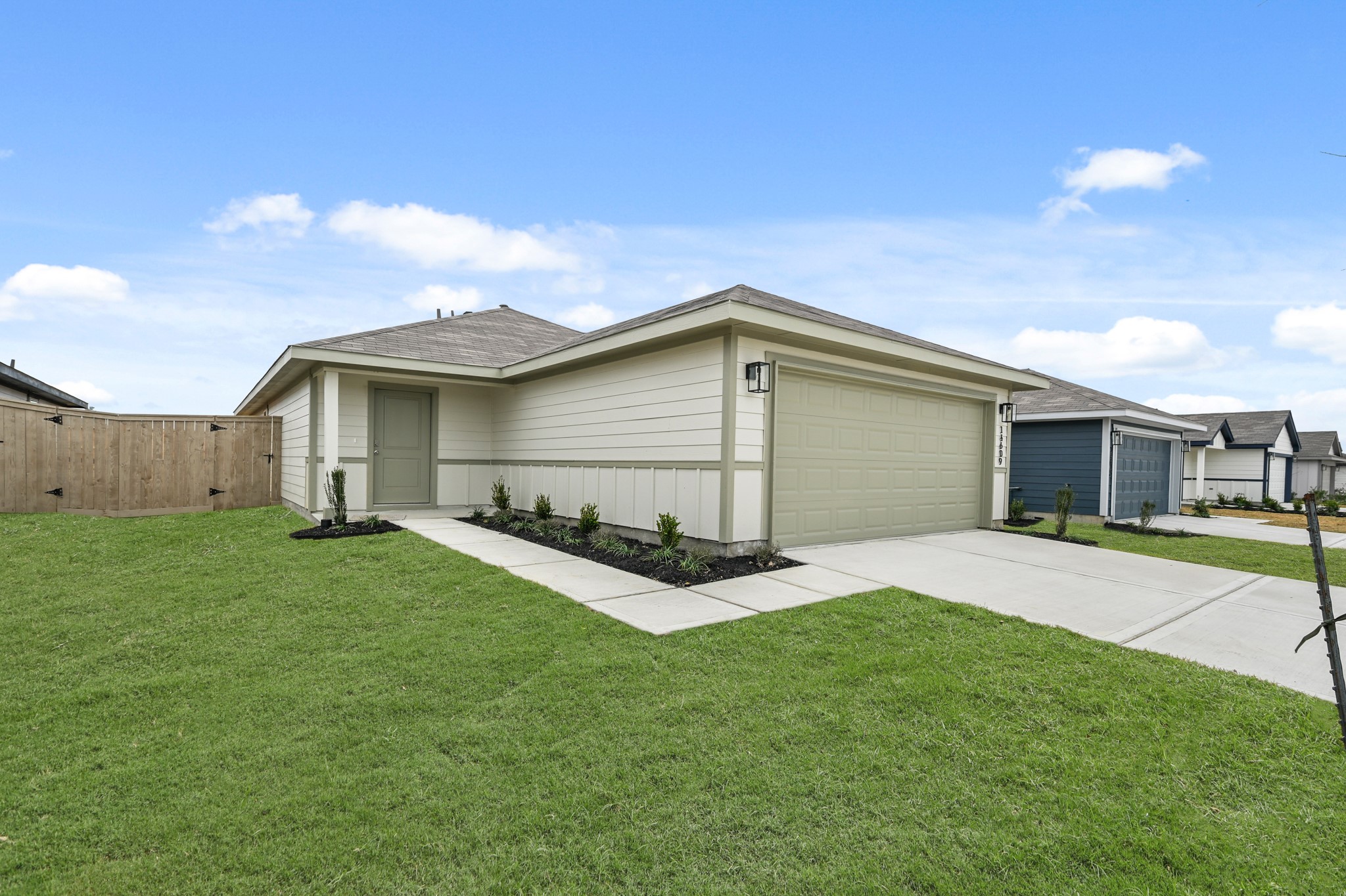 14609 Ivy Floral Way Splendora, TX 77372 - Photo 2 of 23 a front view of house with yard and green space