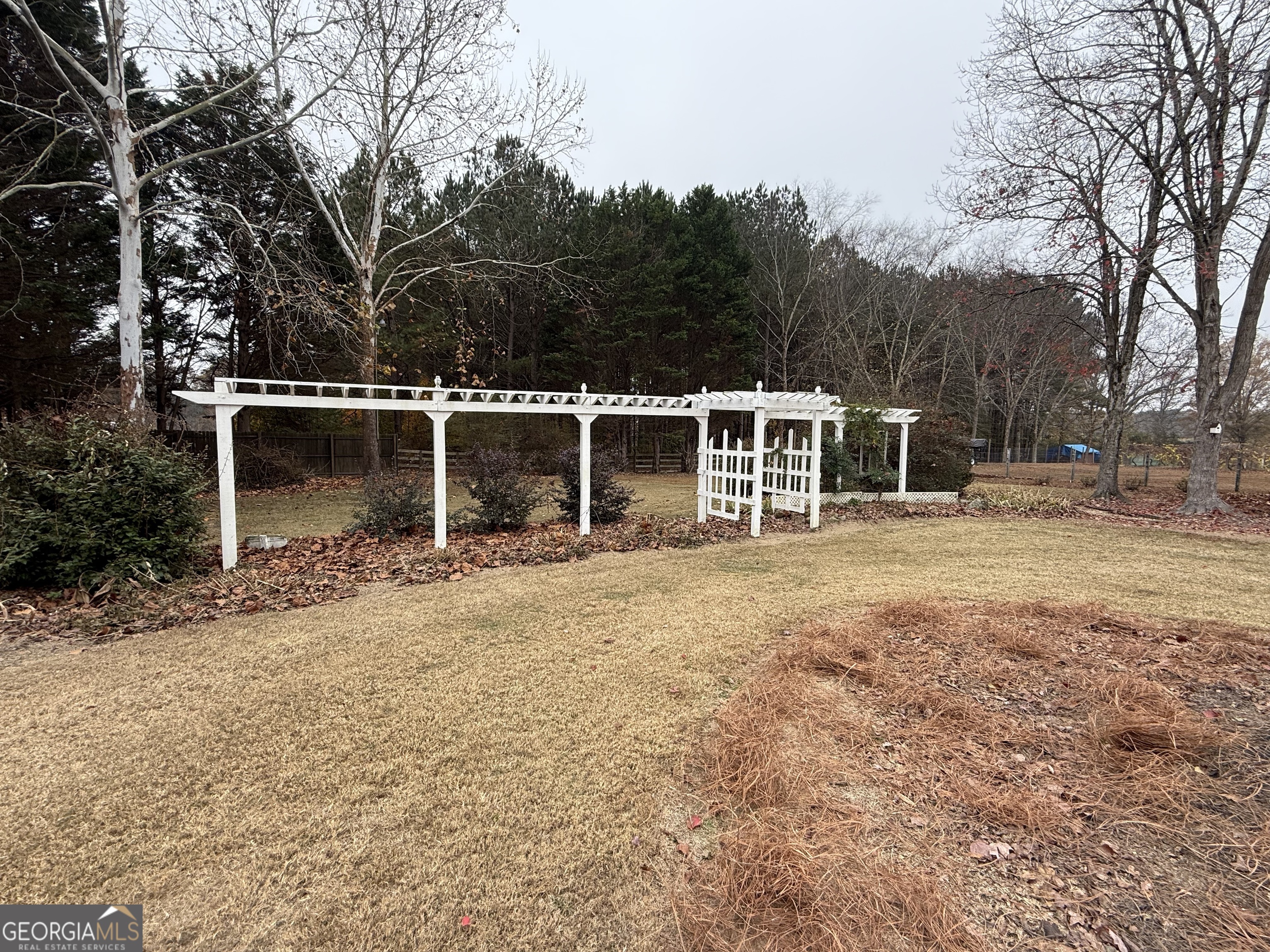 308 Deer Run Williamson, GA 30292 - Photo 10 of 35 a front view of a house with a yard and trees