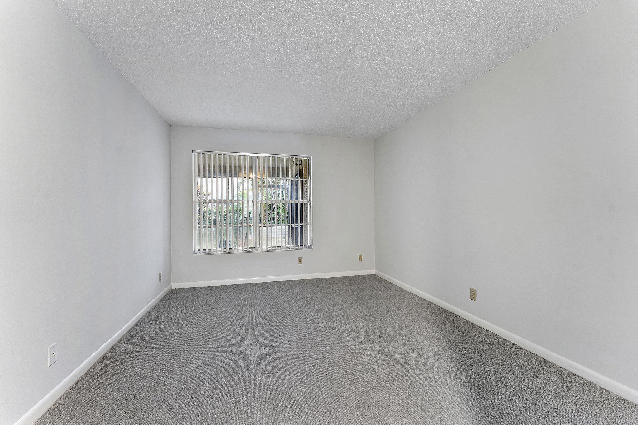 115 Oakwood Drive Jupiter, FL 33458 - Photo 19 of 21 a view of an empty room with a window