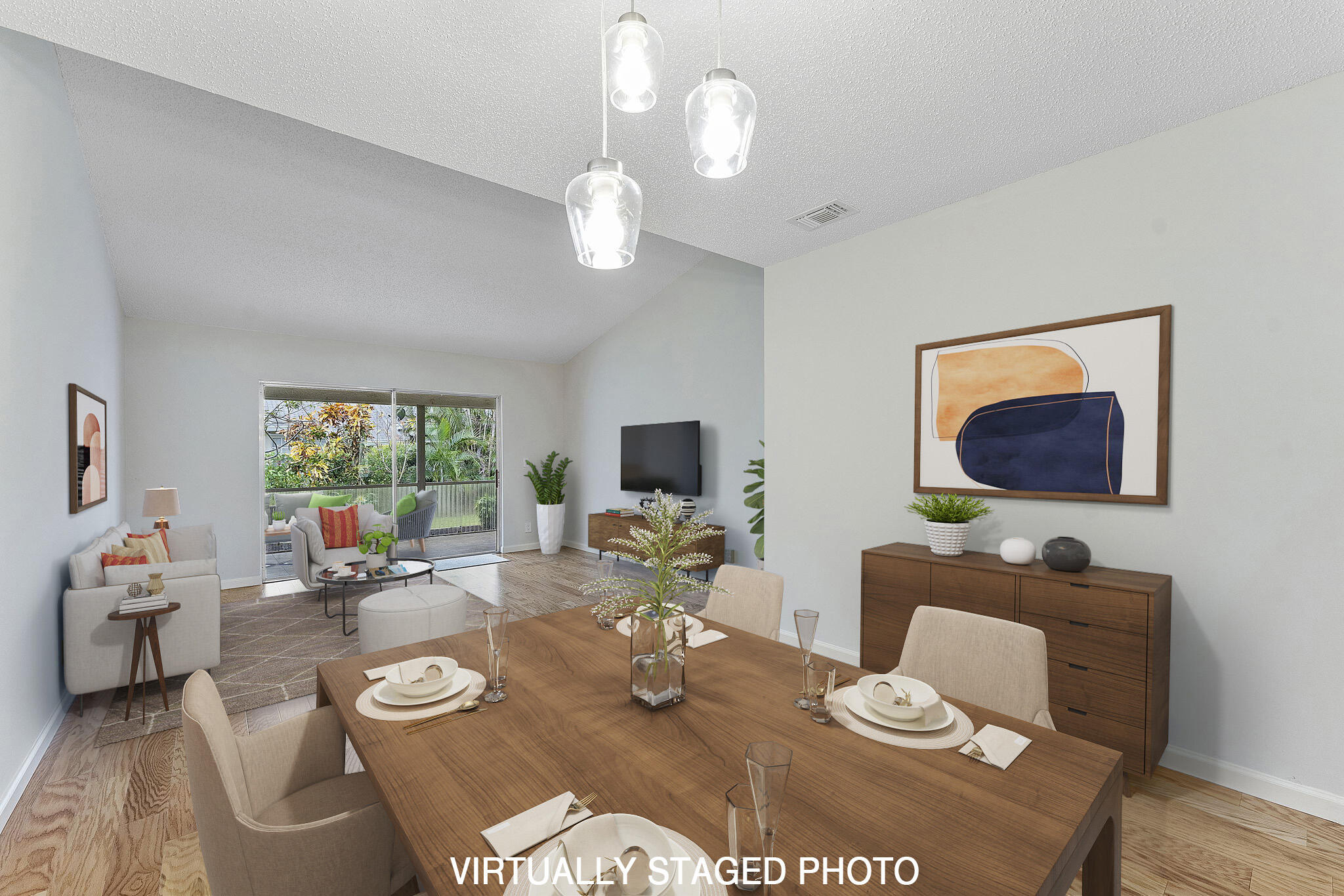 115 Oakwood Drive Jupiter, FL 33458 - Photo 2 of 21 a living room with furniture a large window and a dining table
