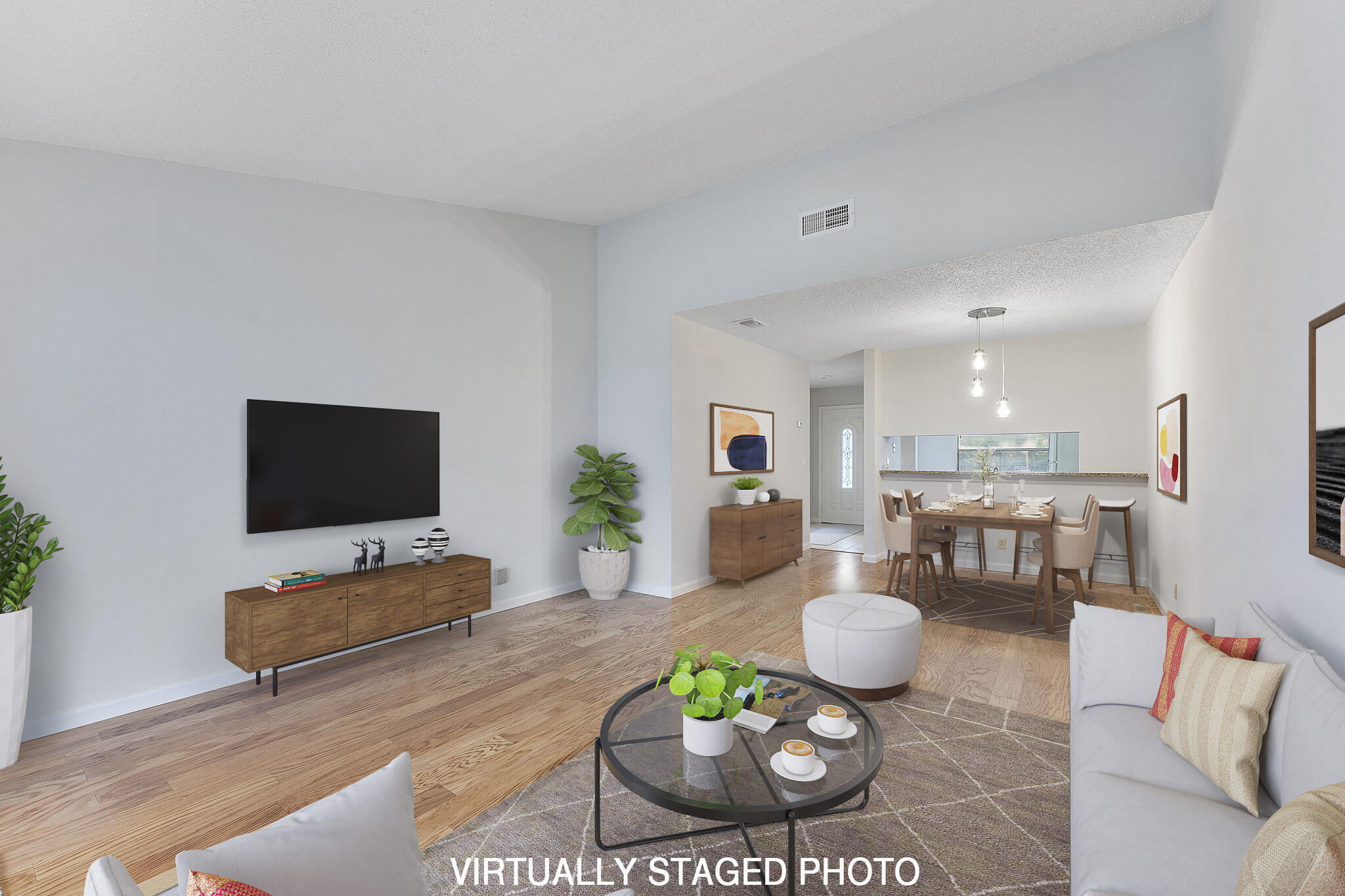 115 Oakwood Drive Jupiter, FL 33458 - Photo 4 of 21 a living room with furniture and a flat screen tv