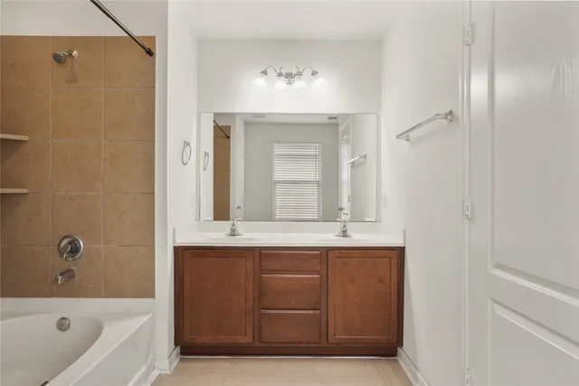 a bathroom with a bathtub and a sink