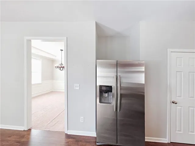 a bathroom with a glass shower door and a mirror
