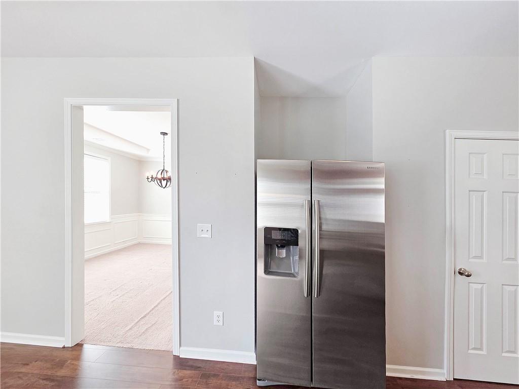 5425 Fieldfreen Drive Cumming, GA 30028 - Photo 16 of 51 a bathroom with a glass shower door and a mirror