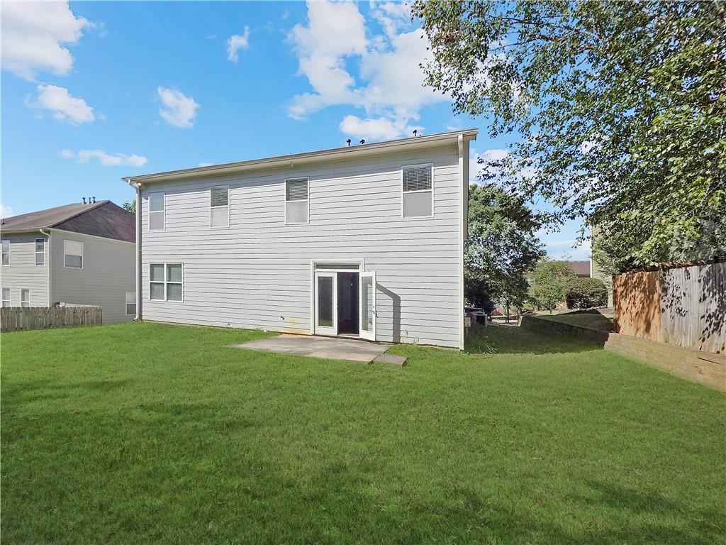 5425 Fieldfreen Drive Cumming, GA 30028 - Photo 23 of 51 a view of a backyard with plants and large tree