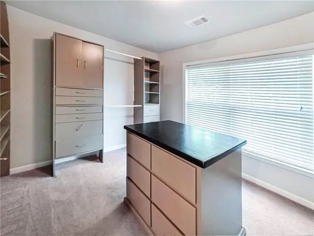 a kitchen that has a sink and a stove