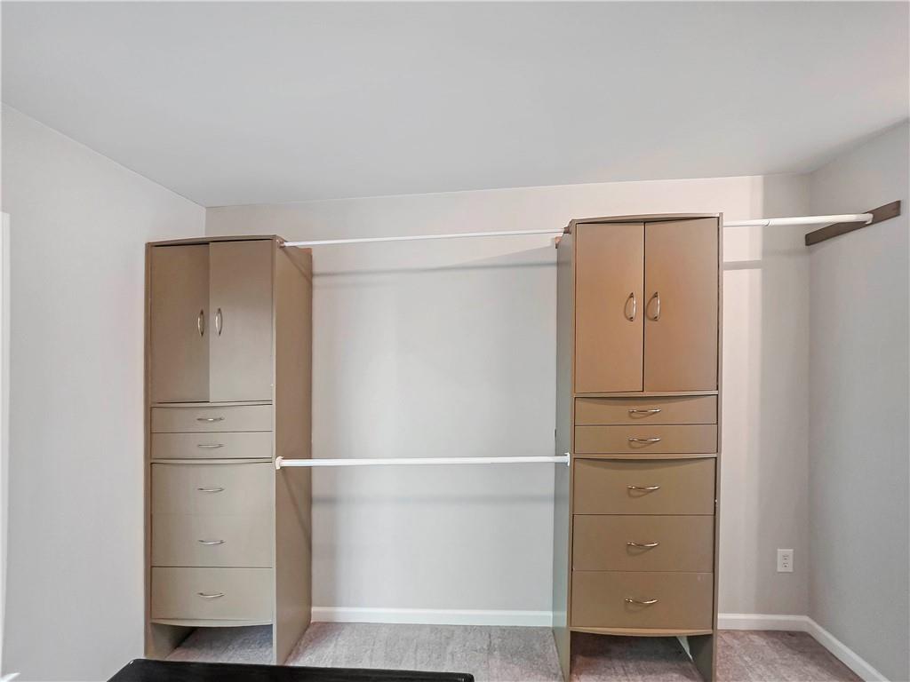 5425 Fieldfreen Drive Cumming, GA 30028 - Photo 39 of 51 a view of walk in closet with empty racks