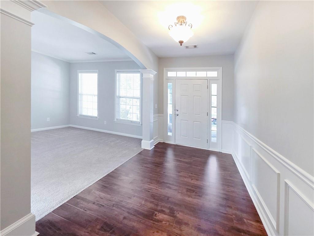 5425 Fieldfreen Drive Cumming, GA 30028 - Photo 4 of 51 wooden floor in an empty room with a window