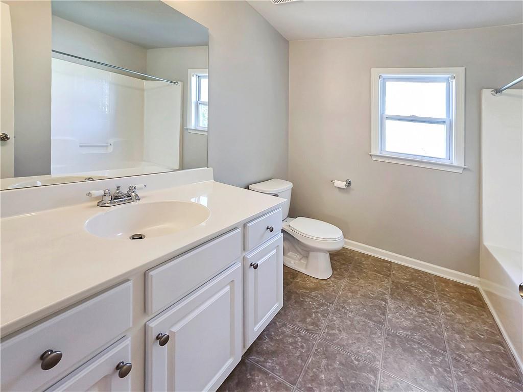 5425 Fieldfreen Drive Cumming, GA 30028 - Photo 42 of 51 a bathroom with a sink toilet and a mirror