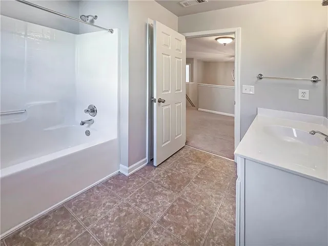 an empty room with a bathroom