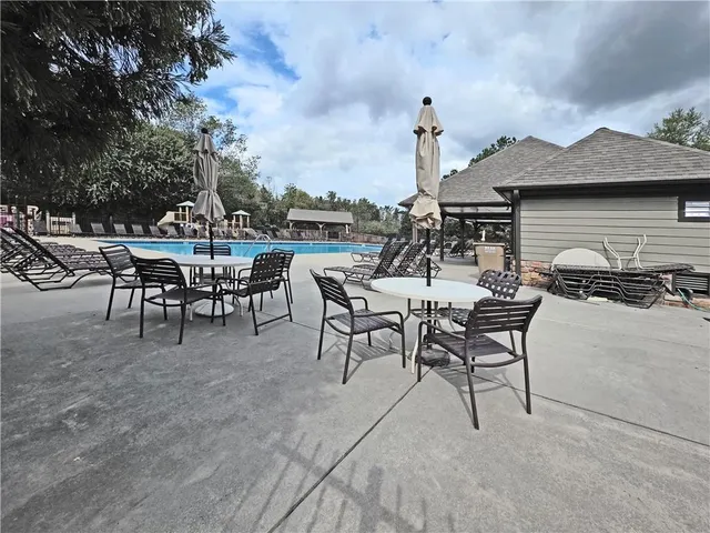 a front view of house with a garden
