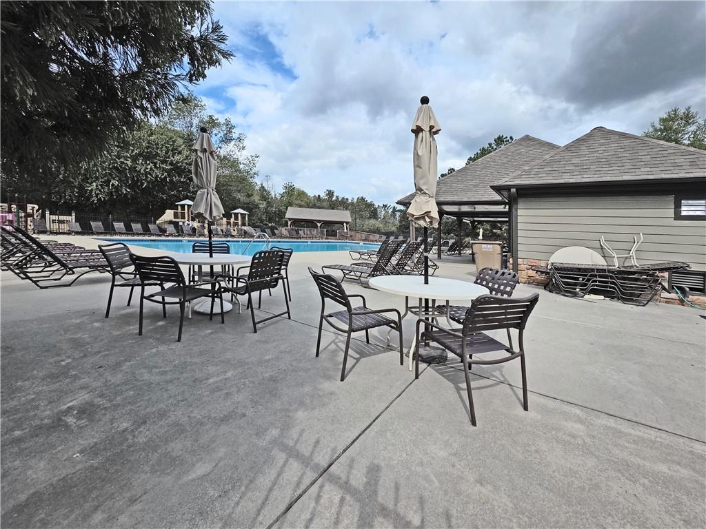 5425 Fieldfreen Drive Cumming, GA 30028 - Photo 48 of 51 a view of a patio with a table and chairs