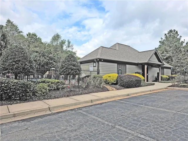 a view of a park with large trees