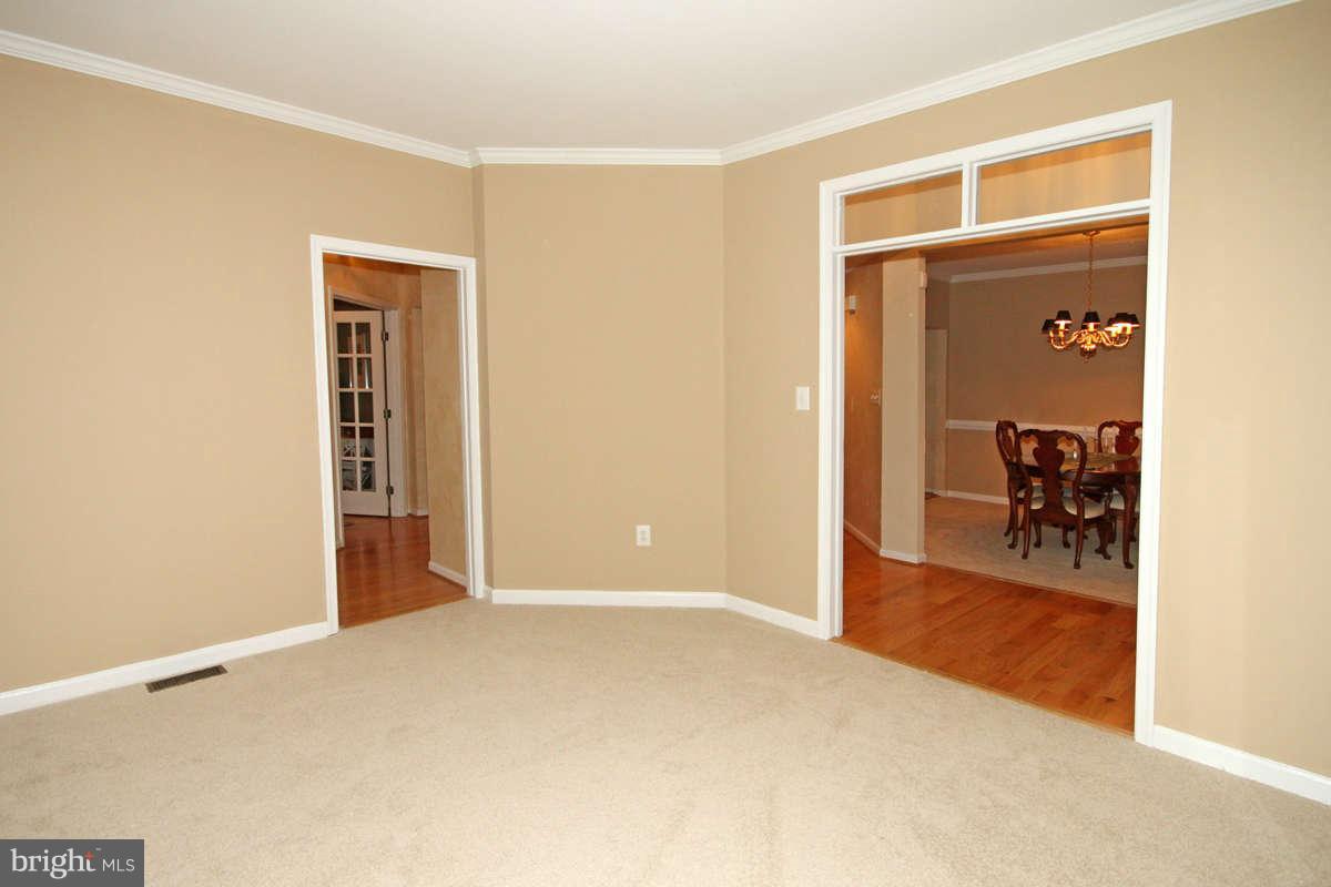 9801 Cresence Way Fairfax, VA 22032 - Photo 2 of 30 a view of a livingroom with a staircase and kitchen