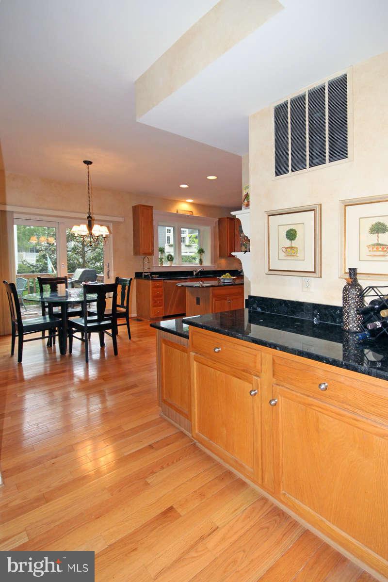 9801 Cresence Way Fairfax, VA 22032 - Photo 12 of 30 a large white kitchen with lots of counter space