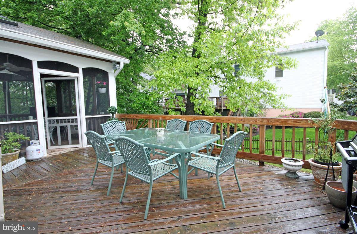9801 Cresence Way Fairfax, VA 22032 - Photo 28 of 30 a patio with wooden floor yard and outdoor seating